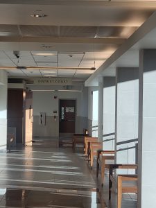 an empty hallway to district court